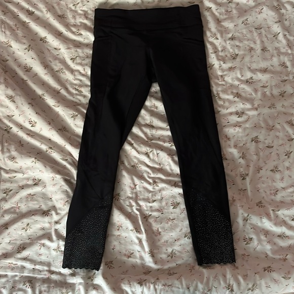 Black Lululemon Size 2 shorter leggings with a design on the bottom - Picture 1 of 4